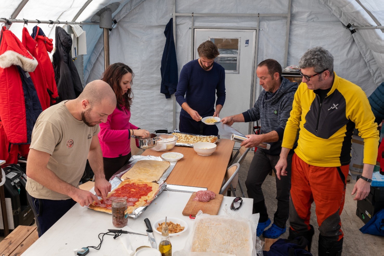 Saverio gets help making the pizzas from (left to right) Andreas, Giuditta, Julien, Michele and Saverio